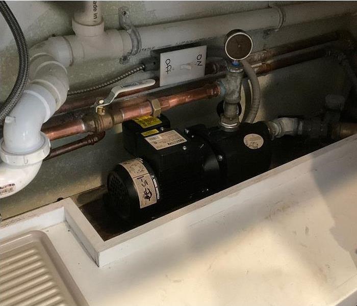 Well pump located under kitchen sink