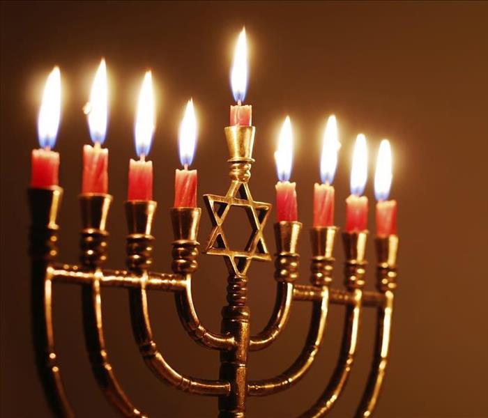 A menorah with all 9 candles burning 
