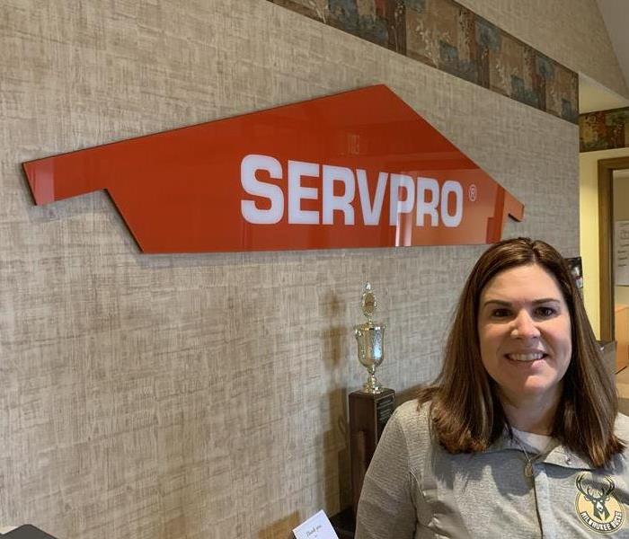 Female standing in front of SERVPRO sign