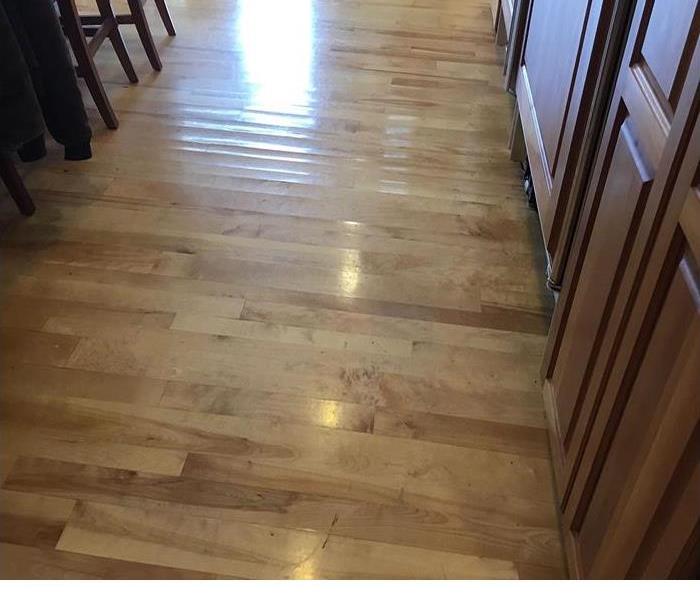 A light color wood floor in a kitchen