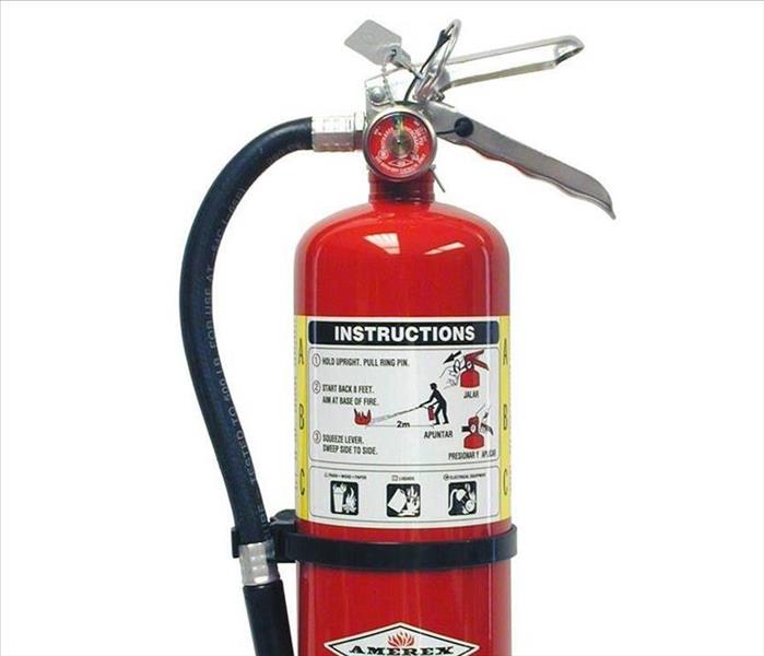 A red fire extinguisher sits on a white background