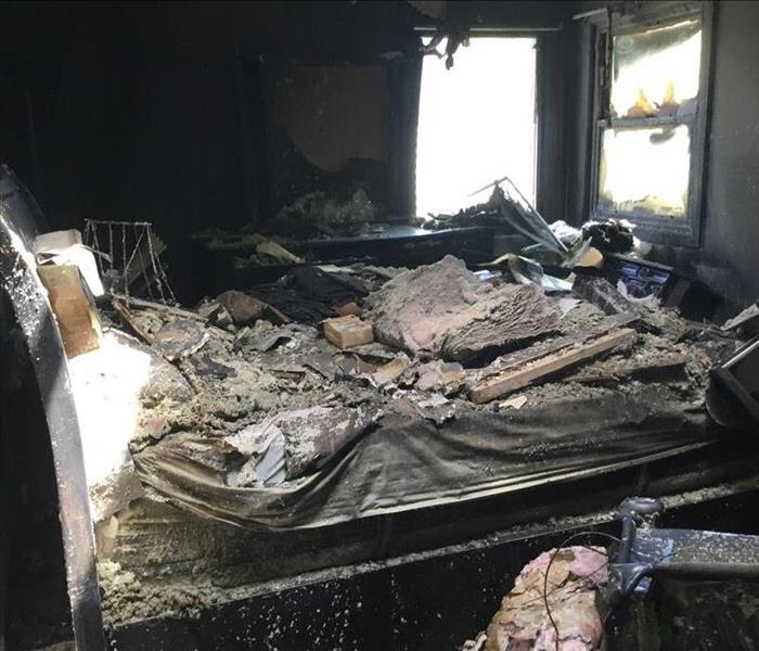 A home has been burned due to a space heater; everything is charred and in very poor condition